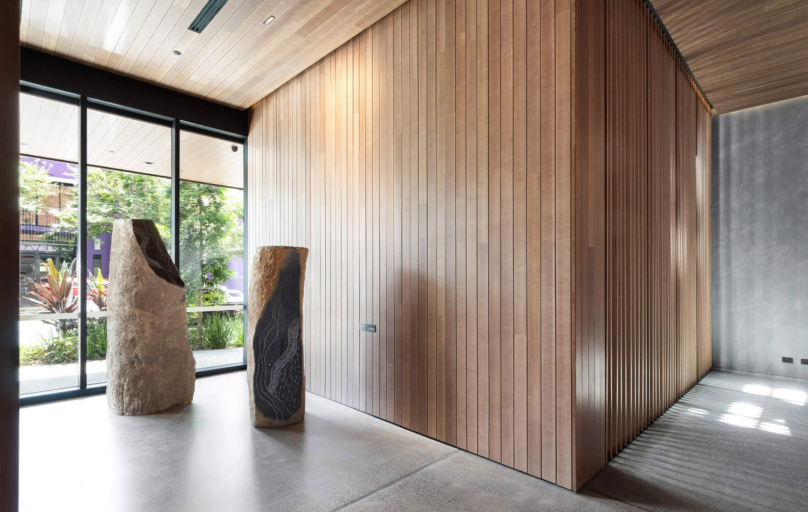 Indigenous sculptures against Sculptform Tongue and groove walls and ceilings